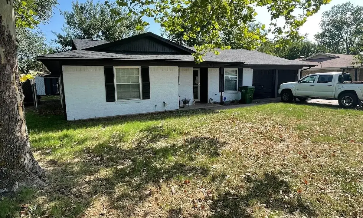 Professional roofing crew working on a residential roof in Elk Plain